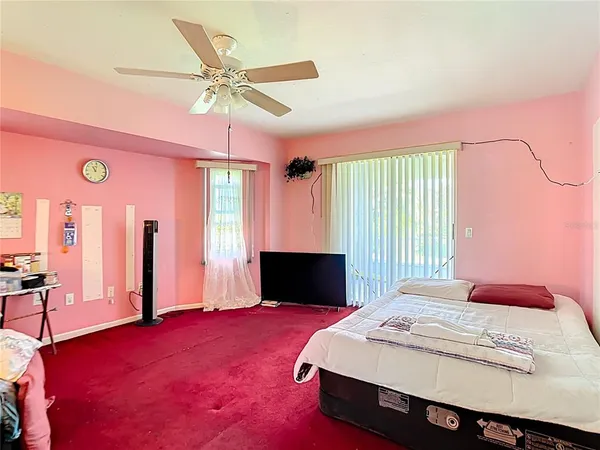 a bedroom with furniture and a window