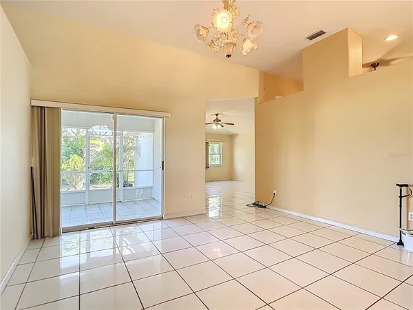 a view of a livingroom with an empty space and a window