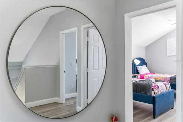a bathroom with a sink toilet vanity and shower
