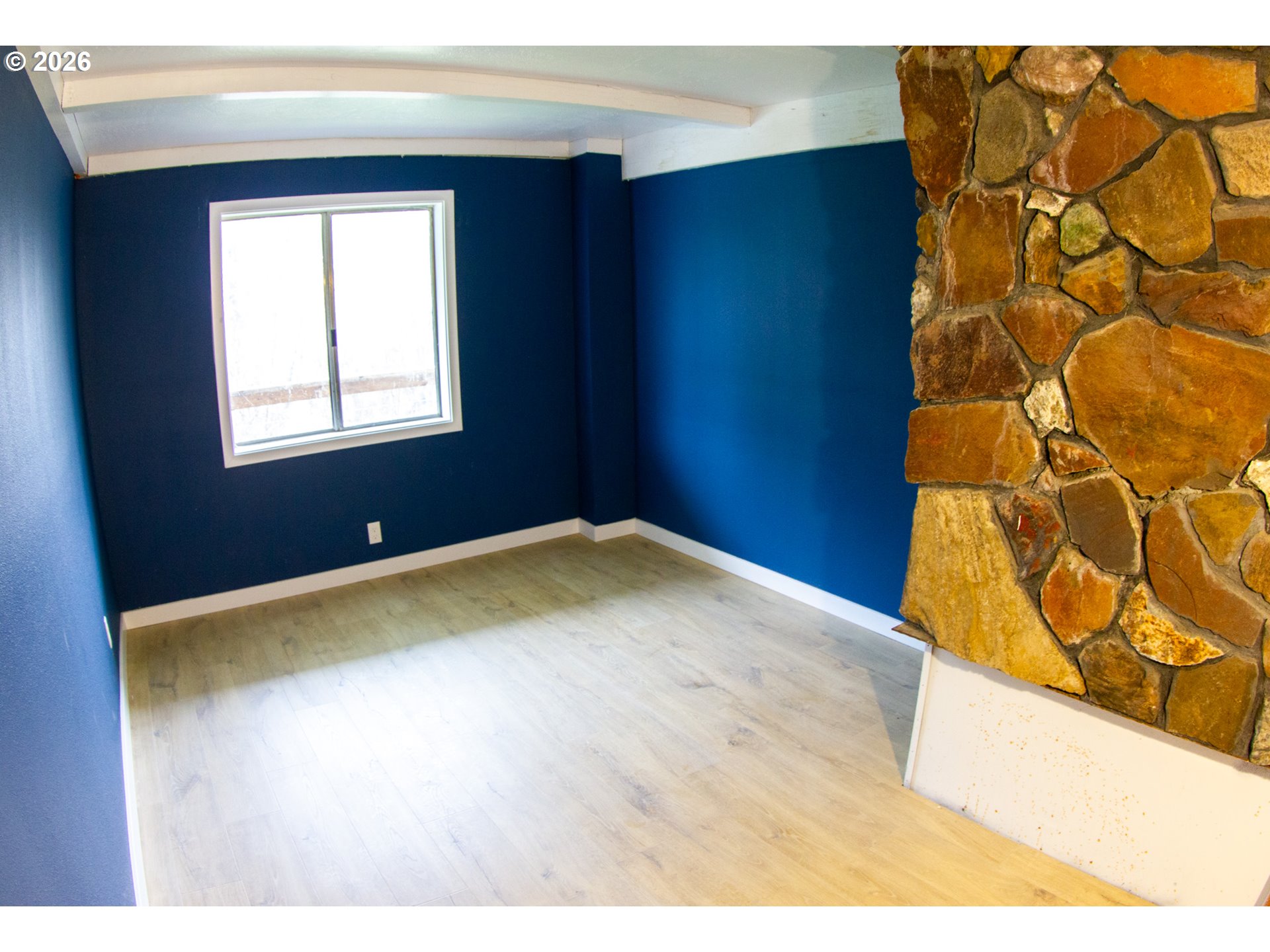 411 Upper Terrace Lane Glide, OR 97443 - Photo 16 of 25 a view of an empty room with a window