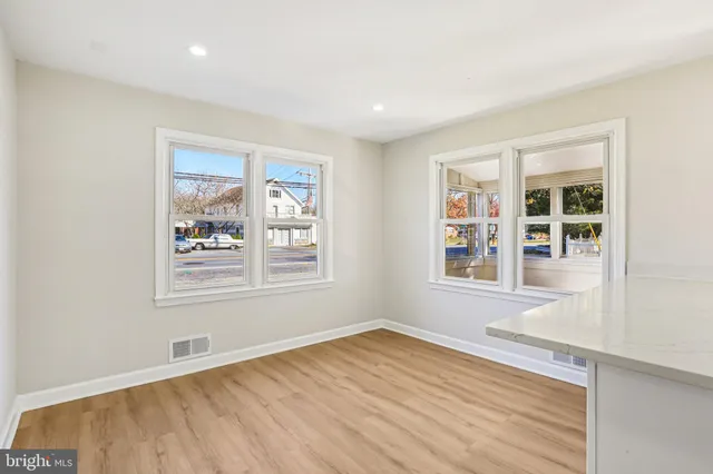 a kitchen with stainless steel appliances granite countertop a stove and a sink