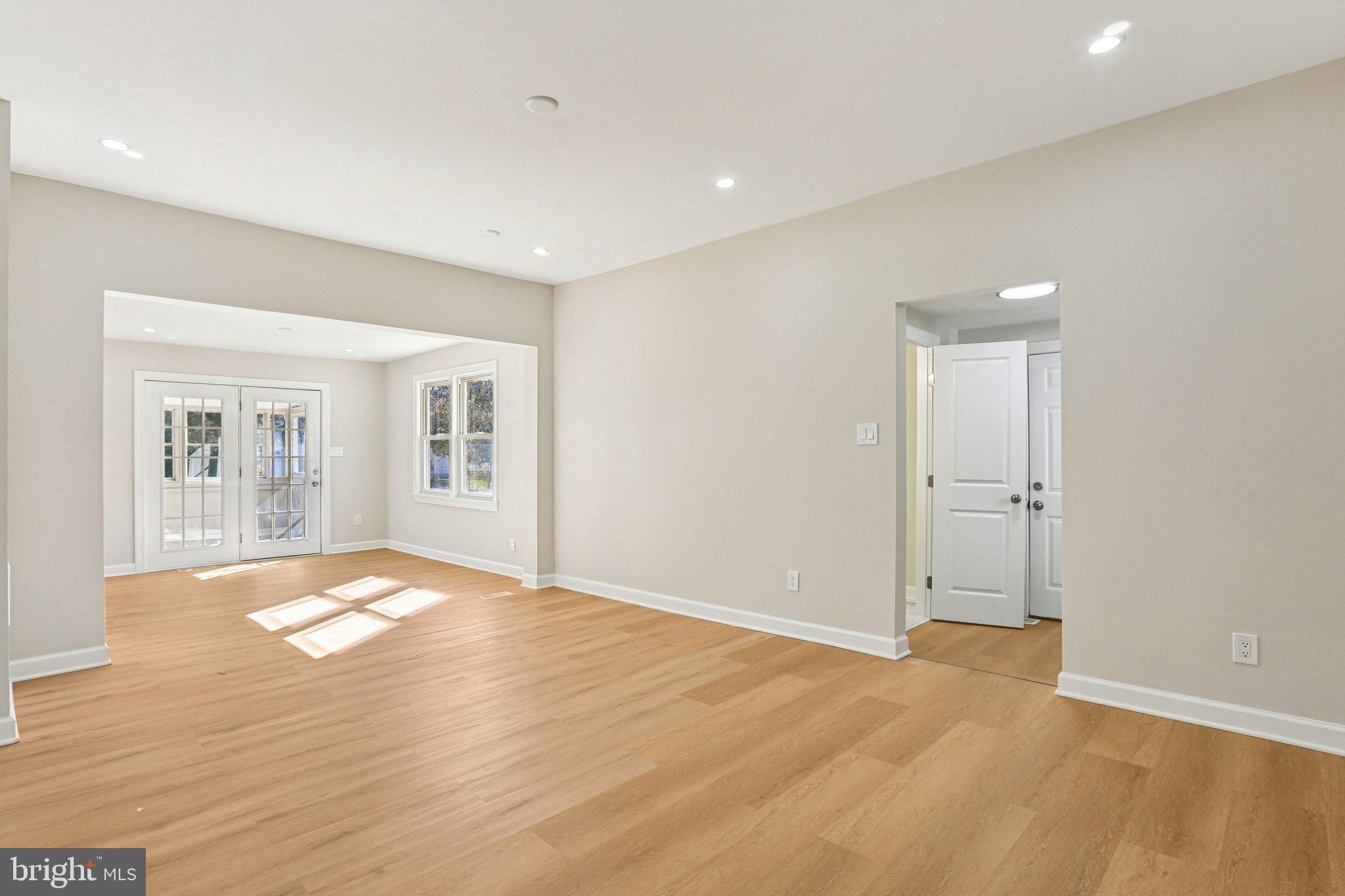 10571 Scaggsville Road Laurel, MD 20723 - Photo 19 of 60 a view of an empty room with wooden floor and a window