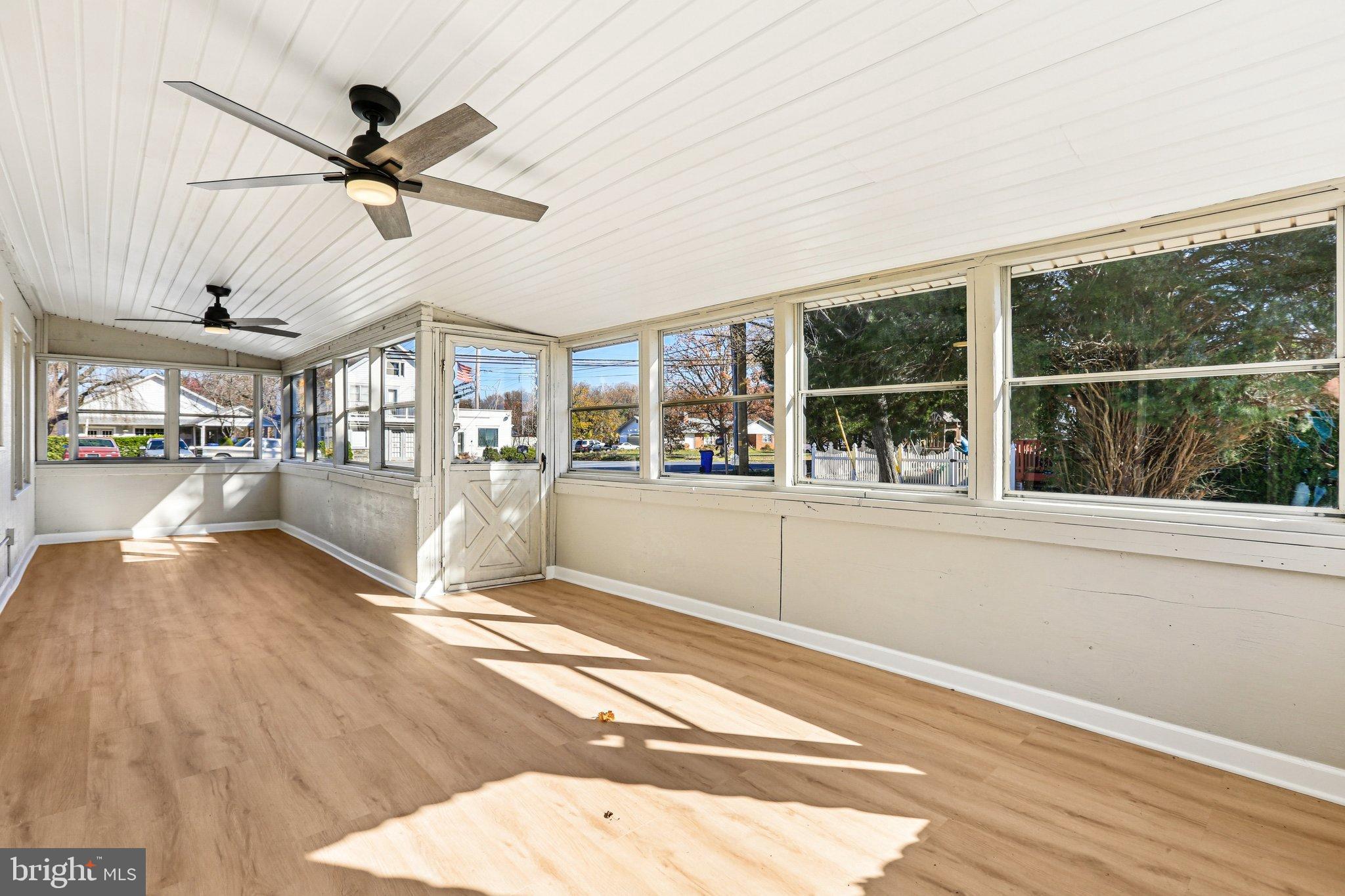 10571 Scaggsville Road Laurel, MD 20723 - Photo 20 of 60 a view of a living room and kitchen with a large window