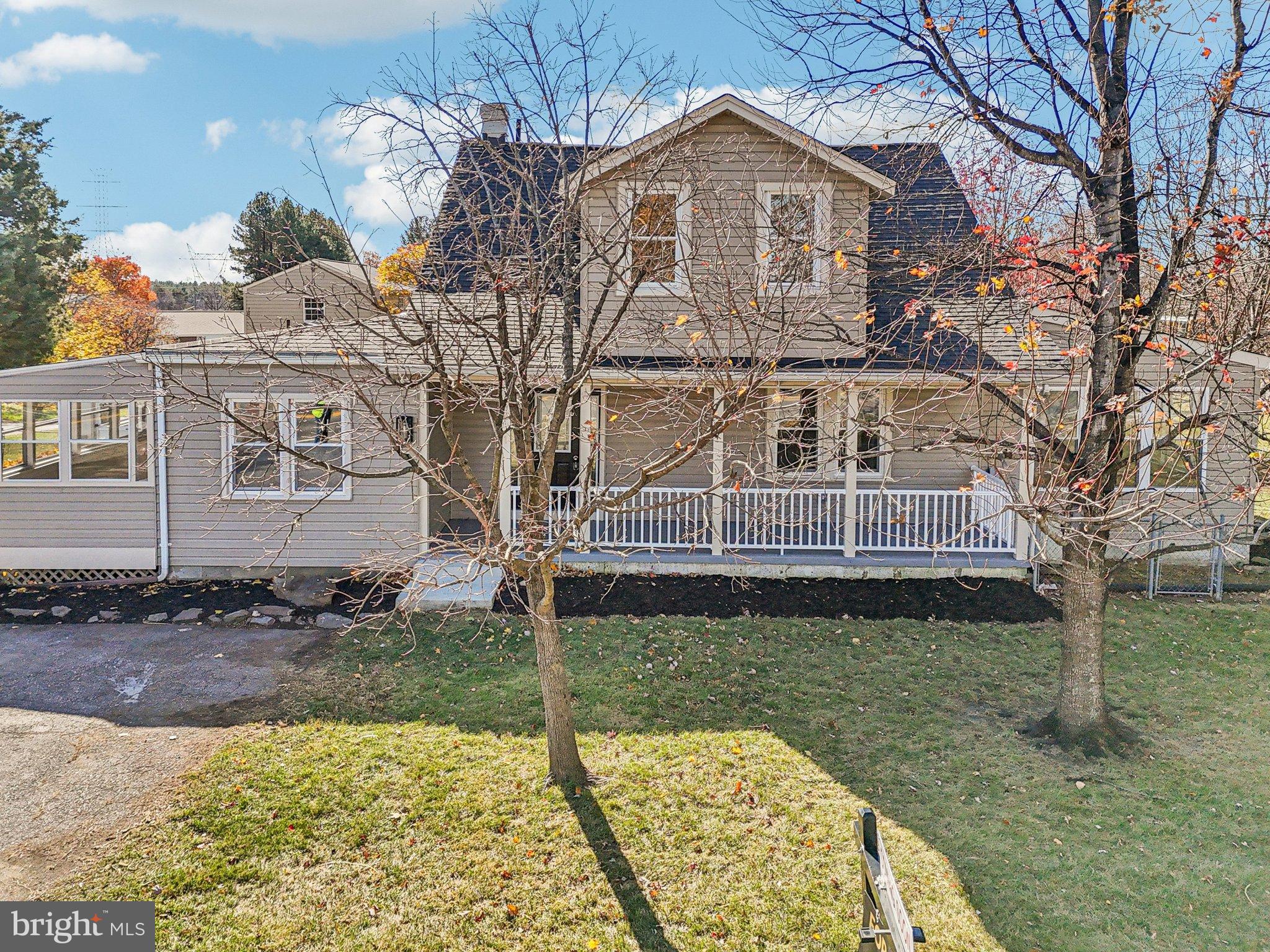 10571 Scaggsville Road Laurel, MD 20723 - Photo 2 of 60 a front view of a house with garden