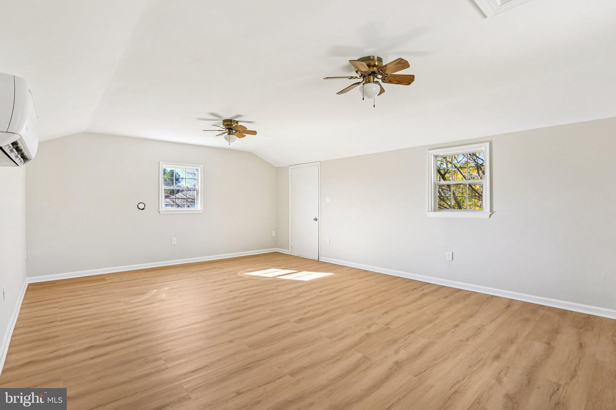 10571 Scaggsville Road Laurel, MD 20723 - Photo 28 of 60 a view of a room with wooden floor and white walls