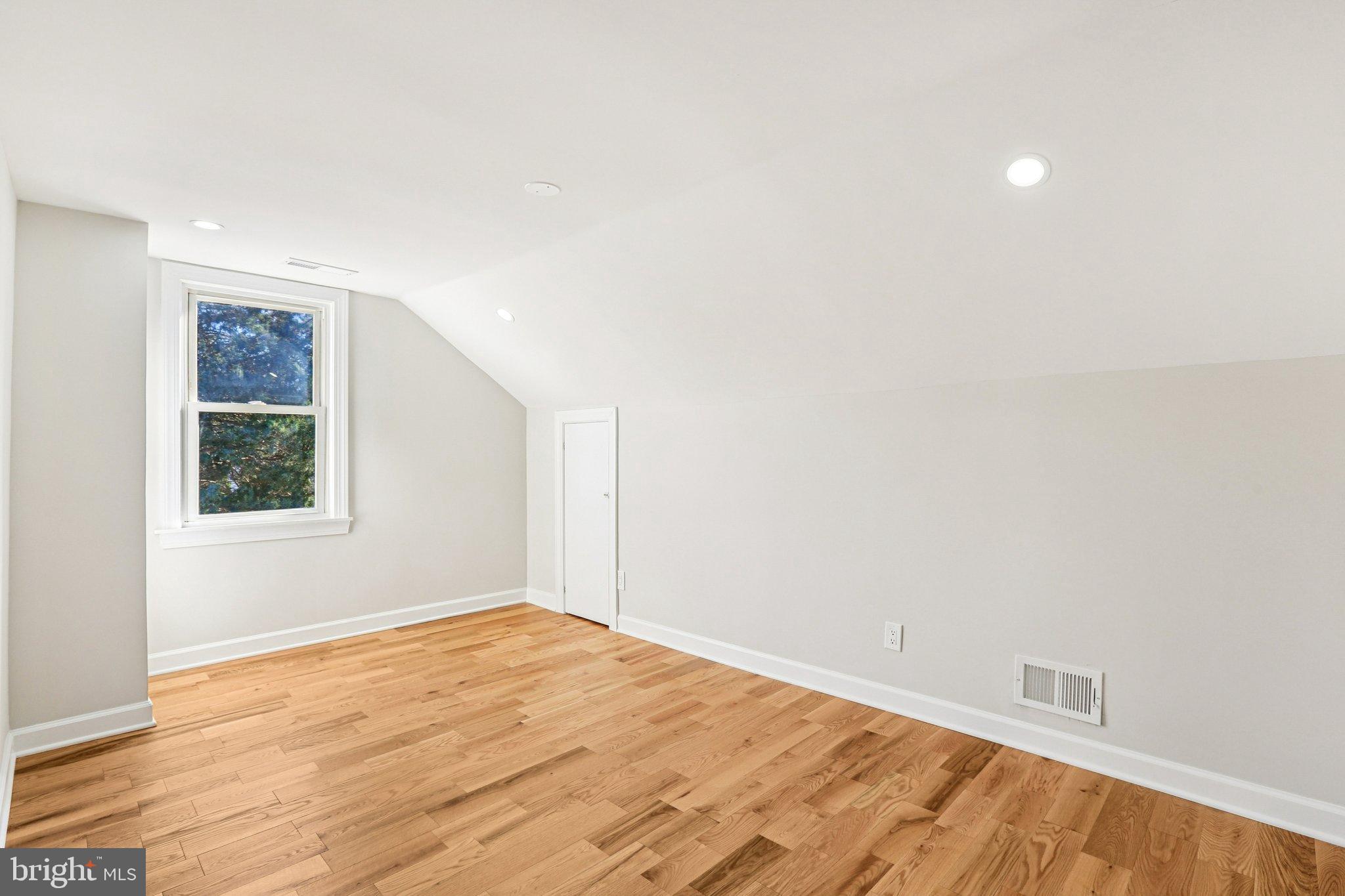 10571 Scaggsville Road Laurel, MD 20723 - Photo 29 of 60 a view of empty room with wooden floor and fan