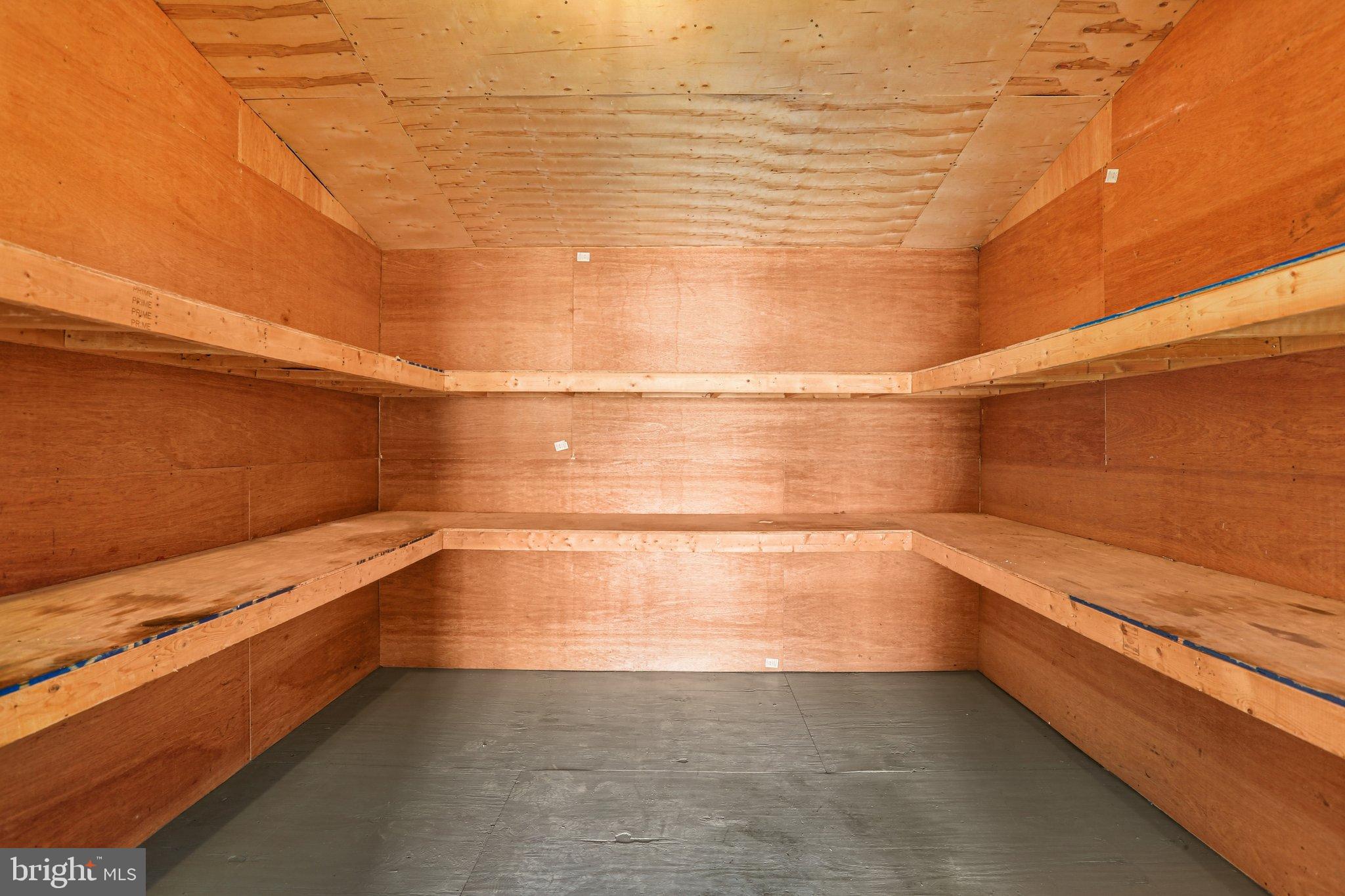 10571 Scaggsville Road Laurel, MD 20723 - Photo 36 of 60 a view of storage and utility room with empty racks