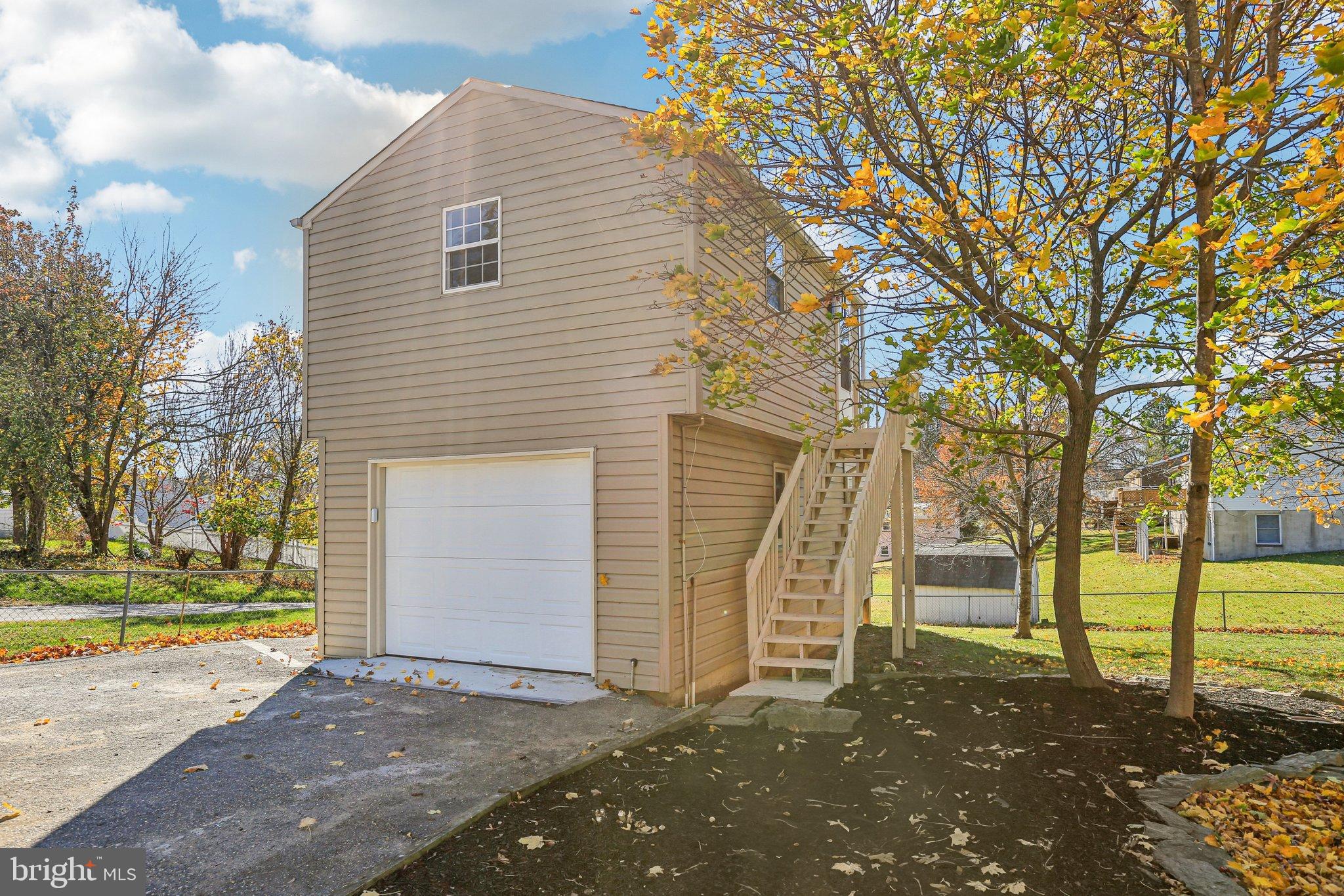 10571 Scaggsville Road Laurel, MD 20723 - Photo 44 of 60 a view of a house with a yard