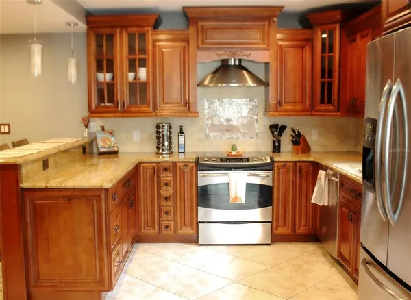 a kitchen with a sink and a refrigerator