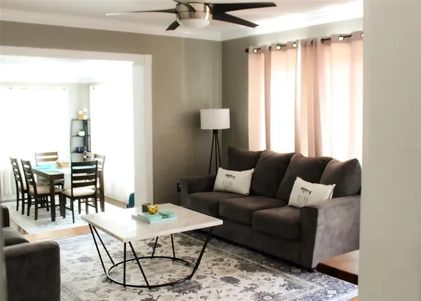 a living room with furniture and a window