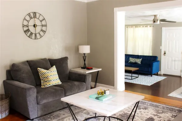 a living room with furniture and a table