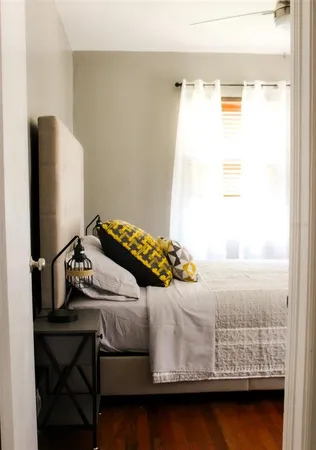 a bedroom with a bed and a table in it