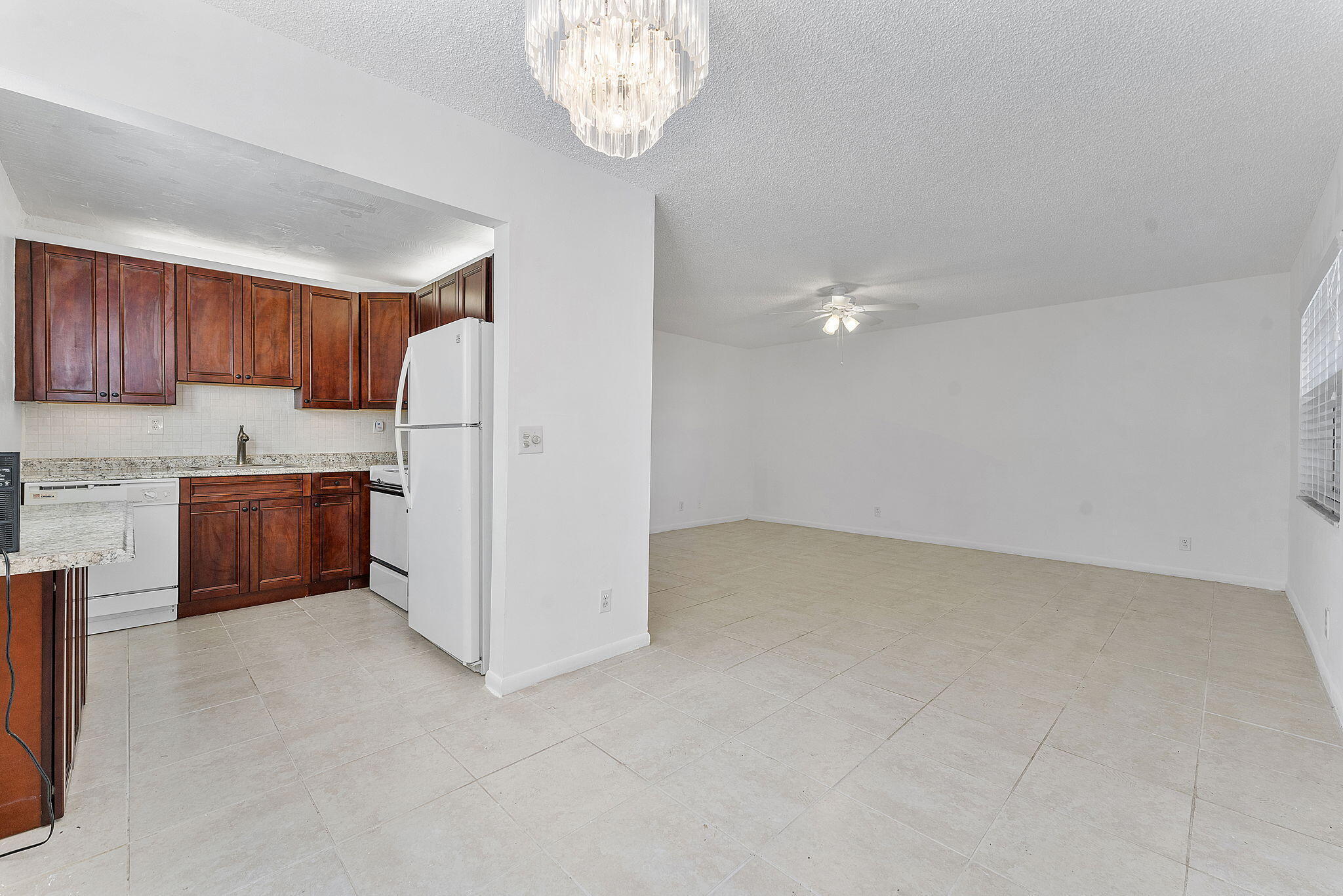 877 Flanders South Delray Beach, FL 33484 - Photo 13 of 27 a view of kitchen and refrigerator