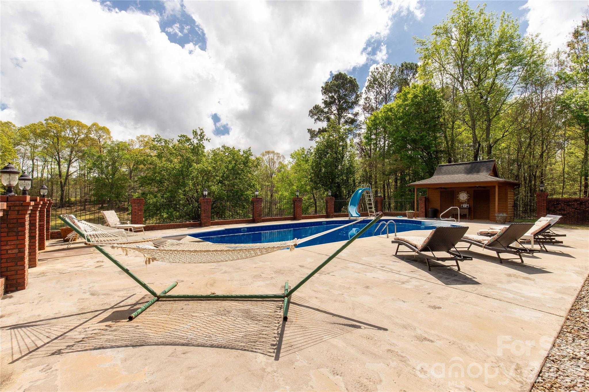 529 Langley Road Lancaster, SC 29720 - Photo 43 of 48 a view of a swimming pool with a lounge chair