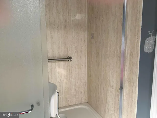 a bathroom with a sink vanity and mirror