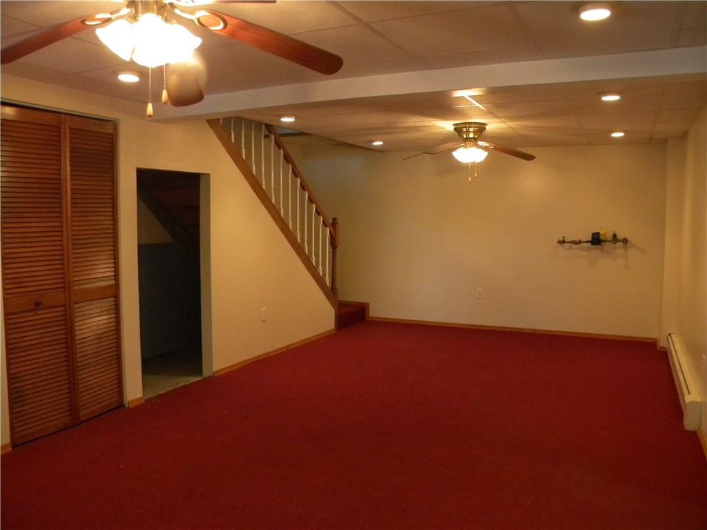 208 Springdale Road Venetia, PA 15367 - Photo 22 of 25 Finished basement with opening for a refrigerator, or use for shelving or storage.
