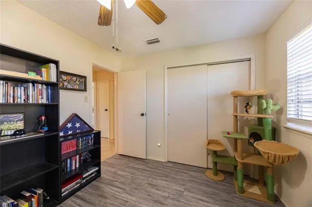 a view of a workspace with furniture and window