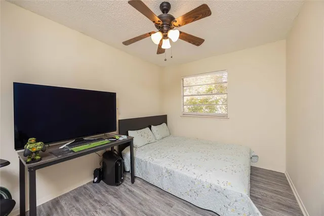 a bedroom with bed and a window