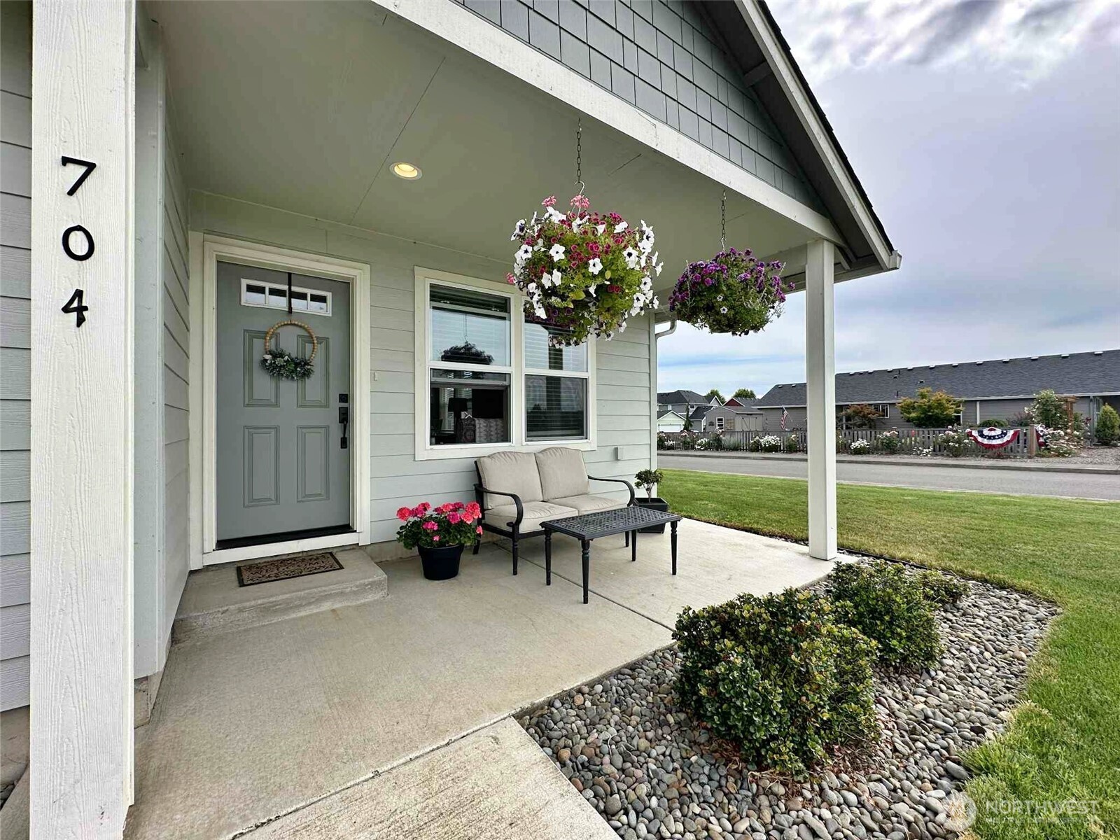 a view of a house with backyard sitting area and garden