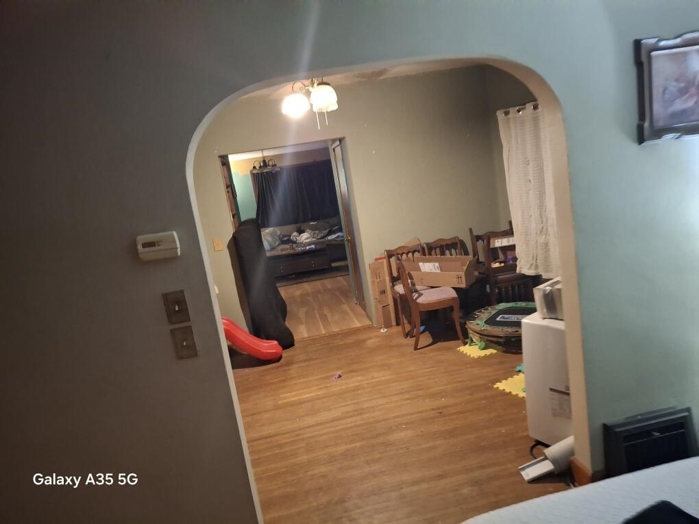 304 Maple Avenue Forreston, IL 61030 - Photo 5 of 7 wooden floor with view of living room