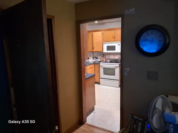 a kitchen with a refrigerator and a stove