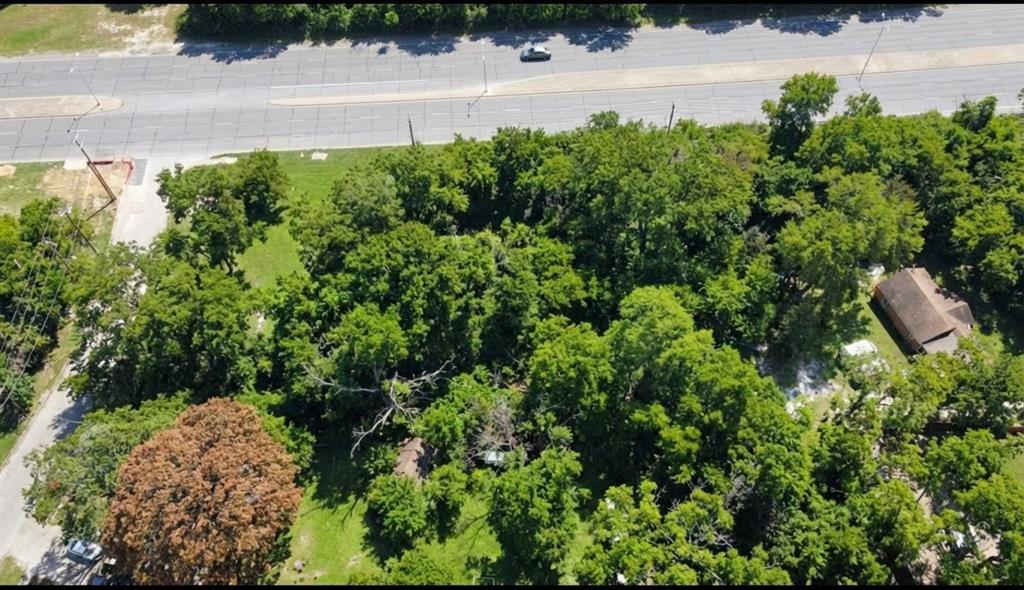 7331 Scyene Road Dallas, TX 75227 - Photo 2 of 3 an aerial view of a house with a yard and garden
