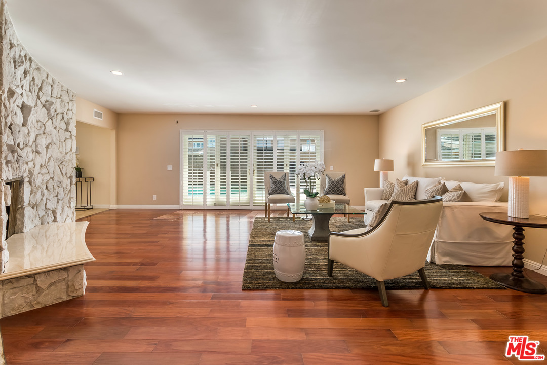 4304 Olympiad Drive View Park, CA 90043 - Photo 11 of 44 a living room with furniture large window and wooden floor