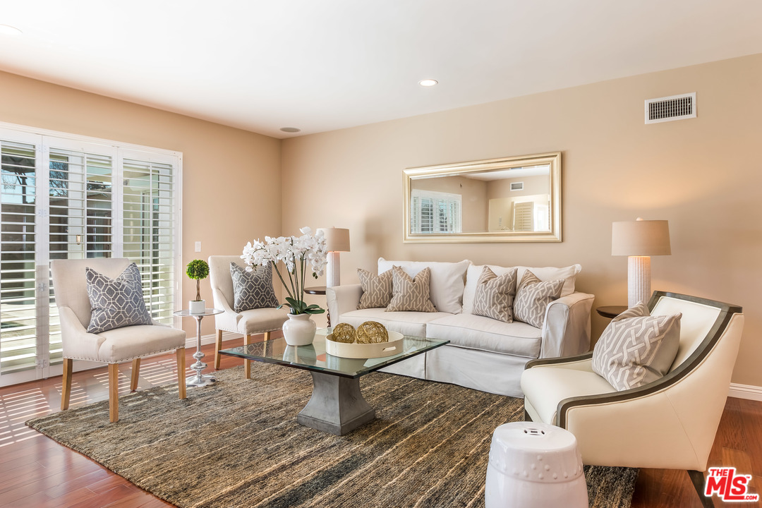 4304 Olympiad Drive View Park, CA 90043 - Photo 12 of 44 a living room with furniture and a rug