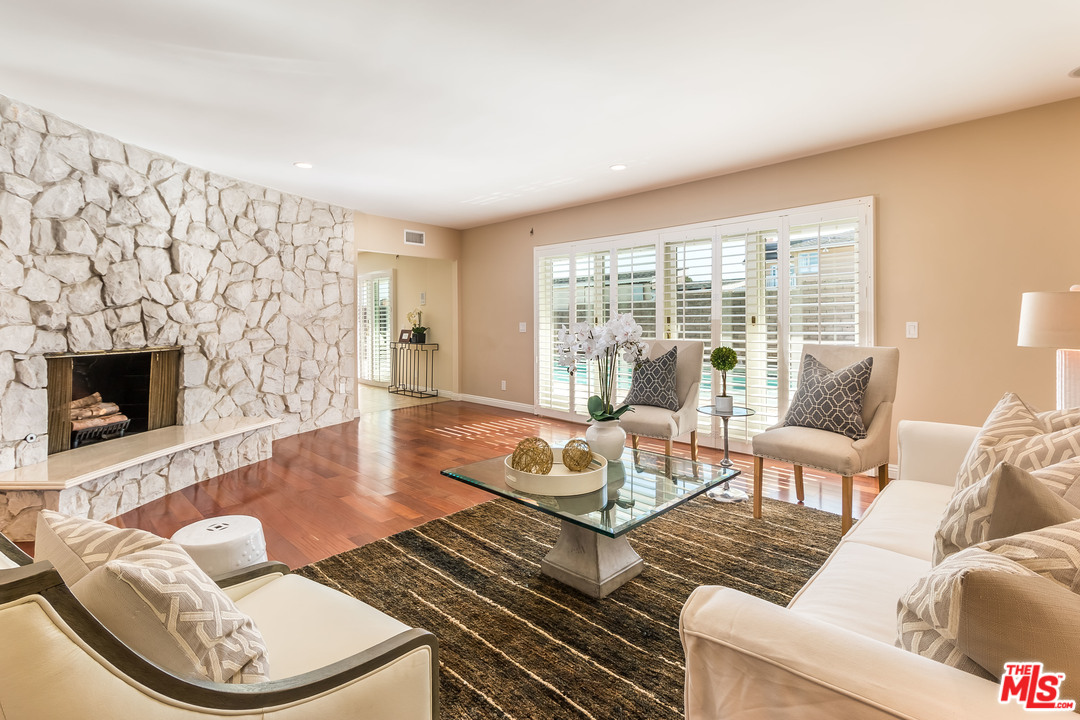 4304 Olympiad Drive View Park, CA 90043 - Photo 13 of 44 a living room with furniture and a fireplace