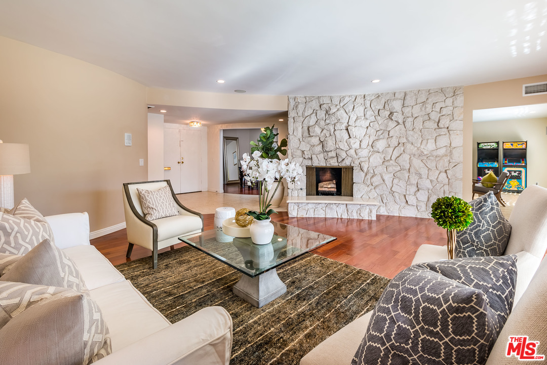 4304 Olympiad Drive View Park, CA 90043 - Photo 14 of 44 a living room with furniture and a fireplace
