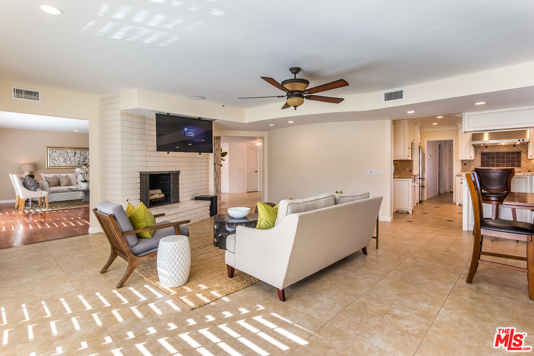 4304 Olympiad Drive View Park, CA 90043 - Photo 18 of 44 a living room with furniture and a fireplace