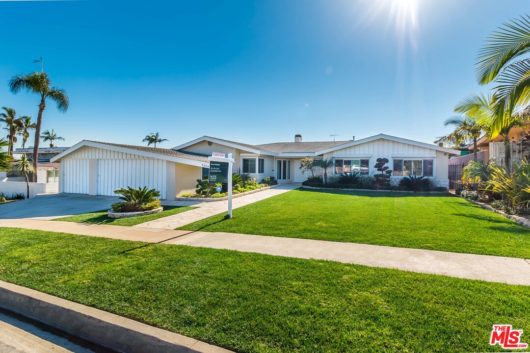 4304 Olympiad Drive View Park, CA 90043 - Photo 3 of 44 a view of house with garden and tall trees