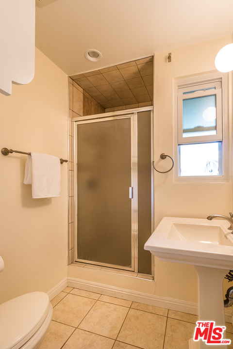 4304 Olympiad Drive View Park, CA 90043 - Photo 24 of 44 a bathroom with a sink and a mirror