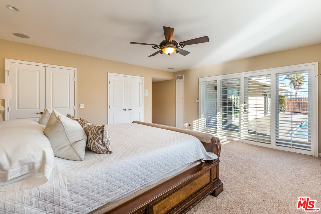 4304 Olympiad Drive View Park, CA 90043 - Photo 34 of 44 a bedroom with a bed and large windows