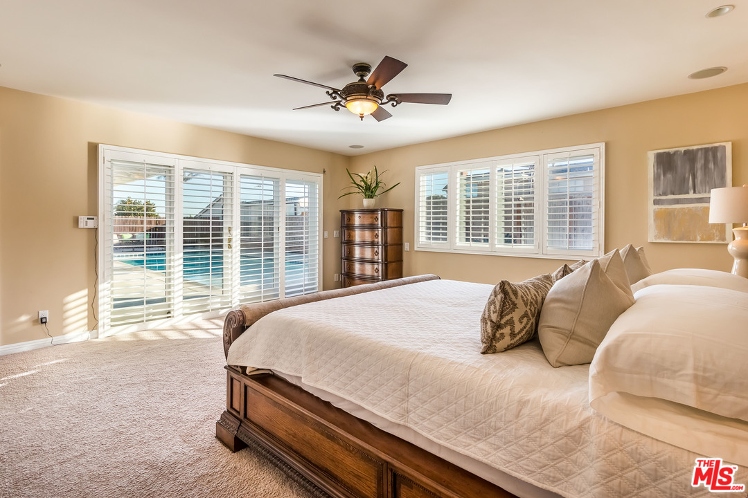 4304 Olympiad Drive View Park, CA 90043 - Photo 35 of 44 a bedroom with a large bed and a large window