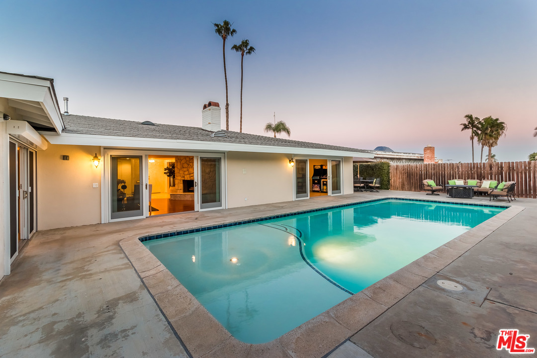 4304 Olympiad Drive View Park, CA 90043 - Photo 40 of 44 a view of a house with a swimming pool