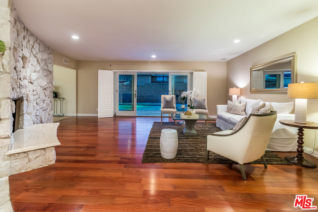 4304 Olympiad Drive View Park, CA 90043 - Photo 41 of 44 a living room with furniture and wooden floor