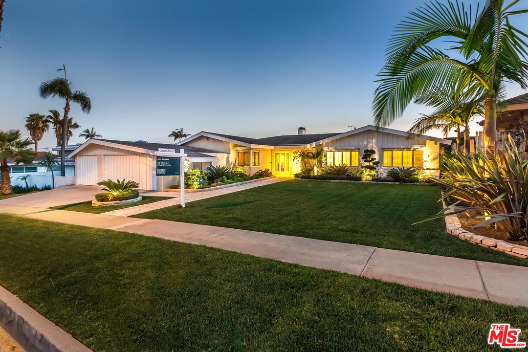 4304 Olympiad Drive View Park, CA 90043 - Photo 44 of 44 a view of a house with a big yard and potted plants