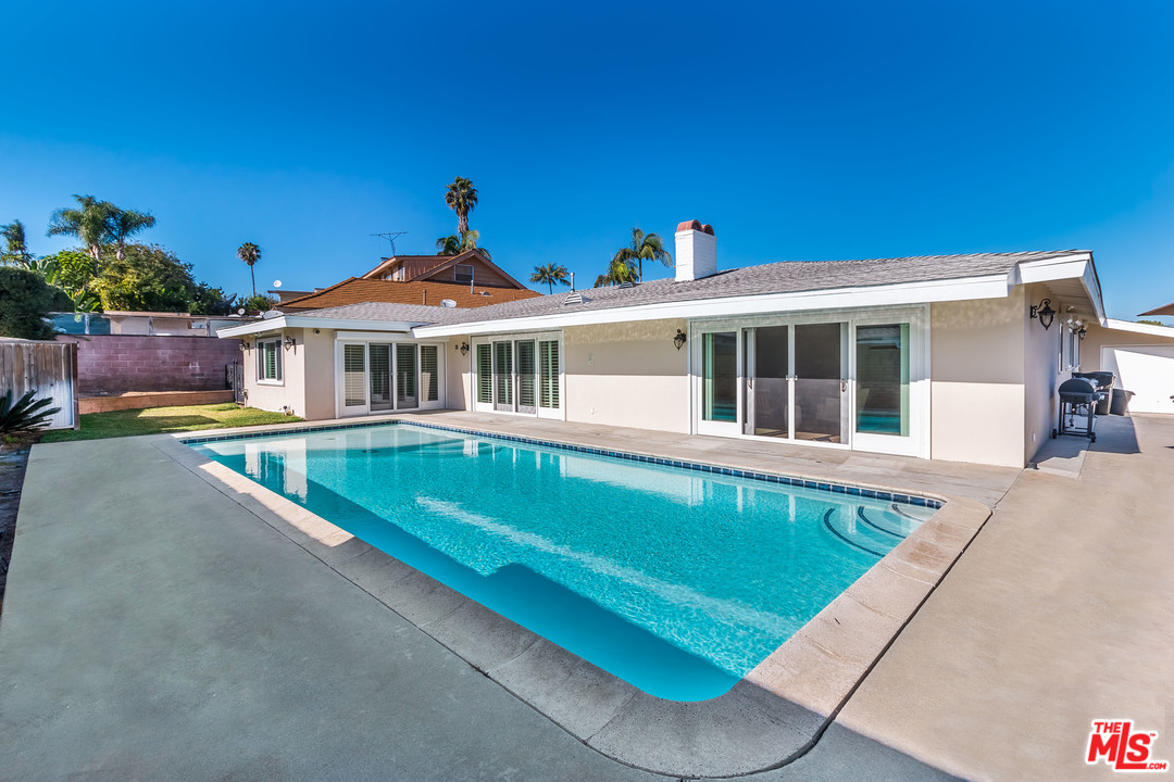 4304 Olympiad Drive View Park, CA 90043 - Photo 6 of 44 a view of a house with pool and a yard