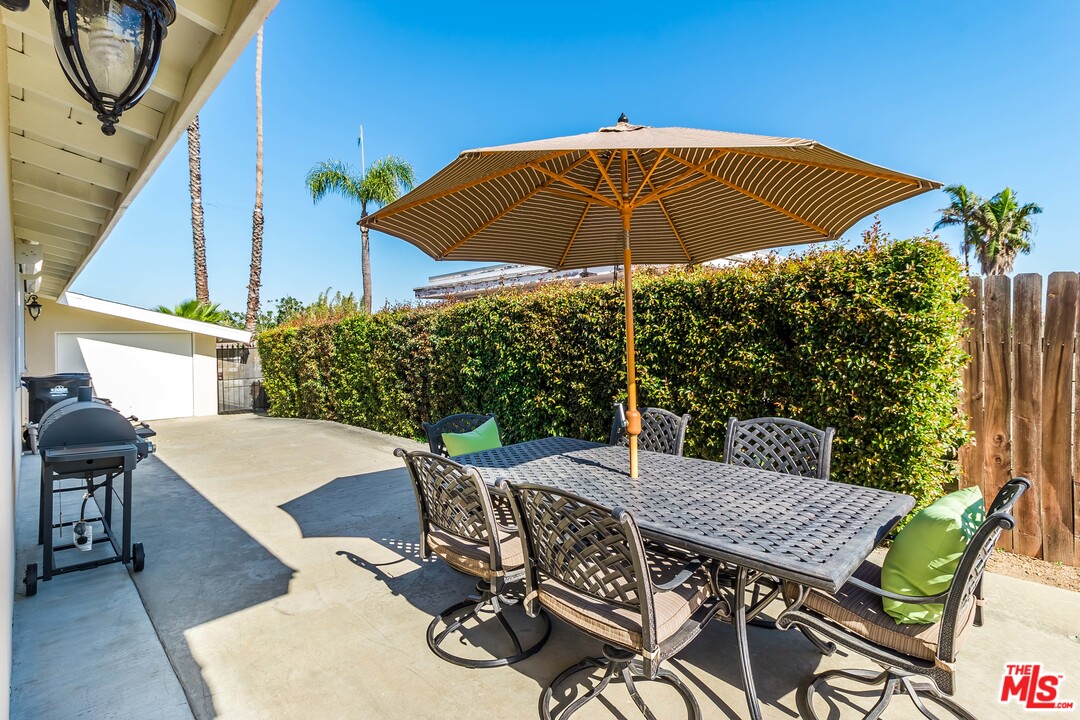 4304 Olympiad Drive View Park, CA 90043 - Photo 10 of 44 a view of an outdoor space with furniture and umbrella