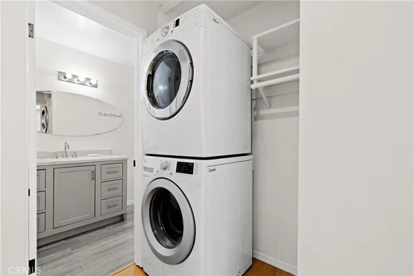 a utility room with sink dryer and washer