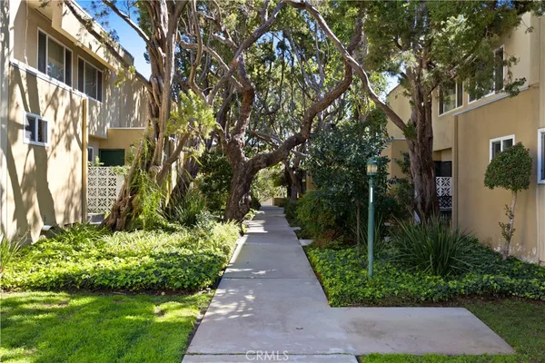 a view of a pathway both side of the house