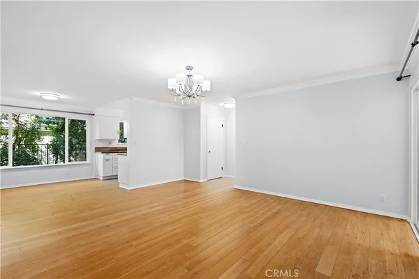 a view of a livingroom with a furniture window and outside view