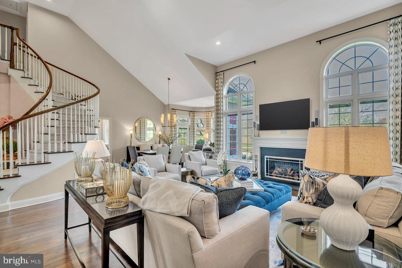 17 Banyan Road Skillman, NJ 08558 - Photo 11 of 53 a living room with furniture a fireplace and a flat screen tv