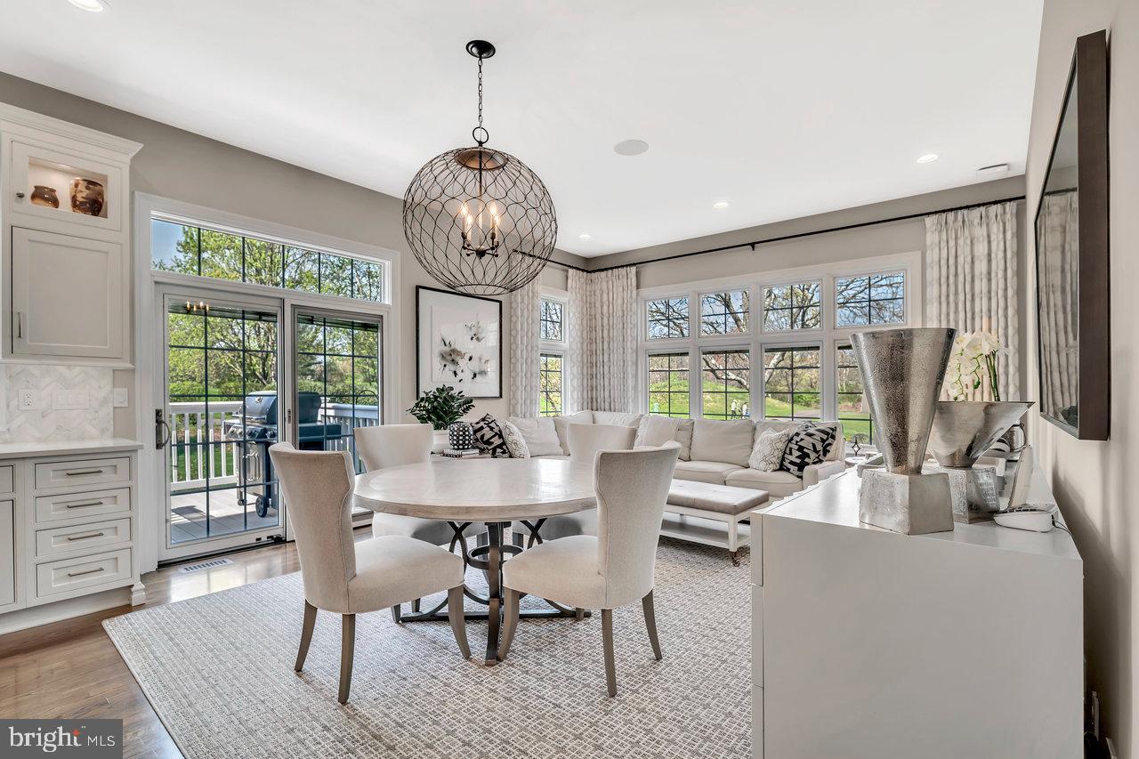 17 Banyan Road Skillman, NJ 08558 - Photo 14 of 53 a view of a dining room with furniture wooden floor and chandelier