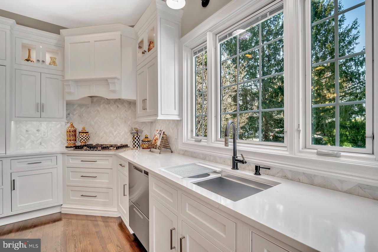 17 Banyan Road Skillman, NJ 08558 - Photo 17 of 53 a kitchen with a sink stove and cabinets