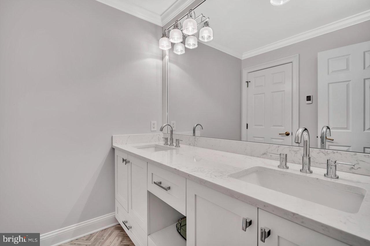 17 Banyan Road Skillman, NJ 08558 - Photo 34 of 53 a bathroom with a sink and a mirror