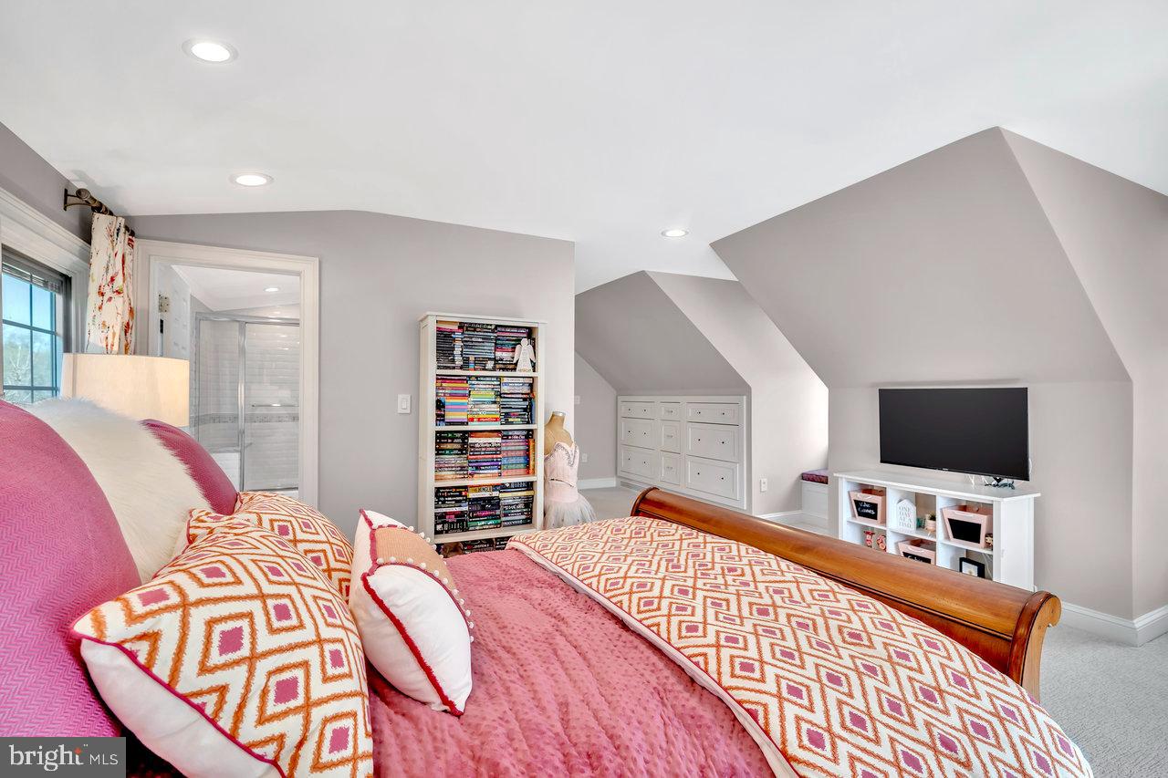 17 Banyan Road Skillman, NJ 08558 - Photo 38 of 53 a bedroom with a bed and a flat screen tv