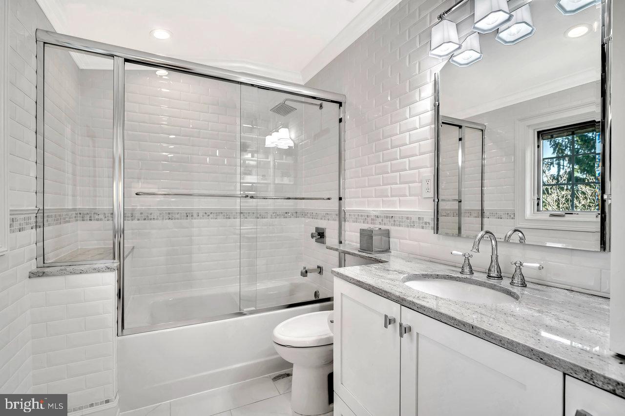 17 Banyan Road Skillman, NJ 08558 - Photo 39 of 53 a bathroom with a granite countertop sink a toilet and shower