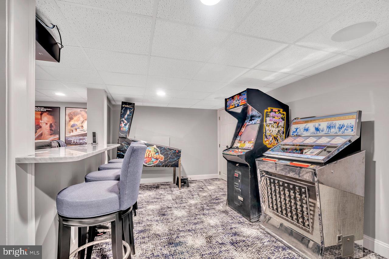 17 Banyan Road Skillman, NJ 08558 - Photo 42 of 53 a living room with furniture and paintings on the wall